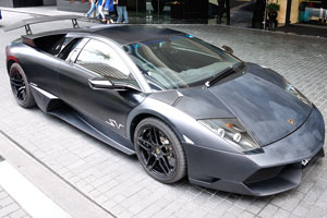 Black Lamborghini in front of Grand Millennium