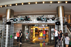 Entrance to Petronas Towers is decorated by the racing cars