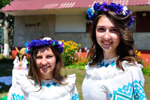 Two attractive Belarusian girls are in blue flower hair wreaths