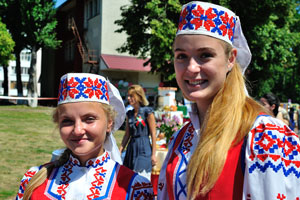 Beautiful girls with dazzling hairs are dressed in the national costumes