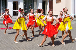 Dancers are dressed in red and yellow clothes