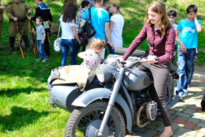 A girl is on the german motorcycle