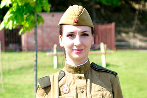 A beautiful woman soldier is on the exhibition