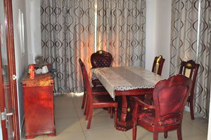 The large dining table is in the hall of the Dacy Guest House