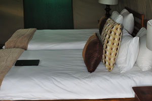 An accommodation includes twin beds with full bed linen