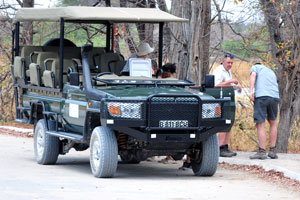 An open-sided safari jeep has arrived to Moremi South Gate