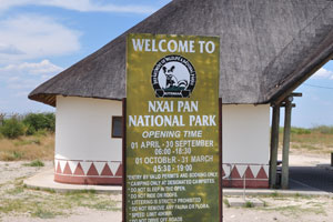 An information board reads: “Welcome to Nxai Pan National Park”