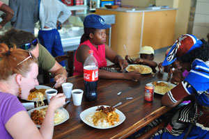 Eating on the same table with a Herero woman in the Choice Take-away & Restaurant in Maun