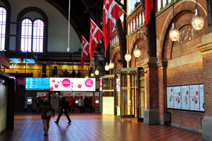 The flags of Denmark are everywhere inside Copenhagen Central Station