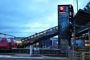 A neon lighting on Dybbølsbro train station reads: “Fisketorvet”