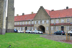 This two storey apartment complex with an arch is located at the backside of the church