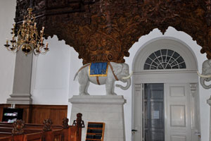 The elephant statues are located below the organ of the Church of Our Saviour