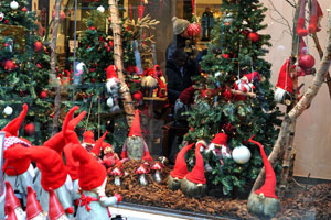 A bright shop window is decorated in the style of festive Christmas decoration