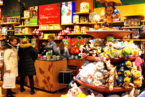 A lovely female cashier is working in Disney toy store