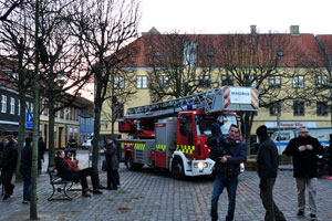 A fire rescue vehicle is parked on Axeltorv square on 27th of November