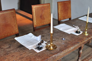 A vintage writing desk with ink and candles is in Kronborg castle