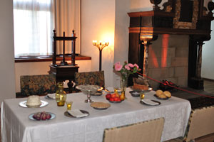 There is a festive table with fruits and cakes in the Royal chambers of Kronborg castle