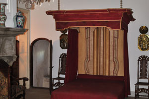 A simple vintage wooden bed is in Kronborg castle