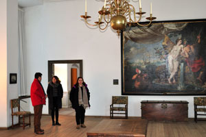 Tourists are inside the King's Chamber of Kronborg castle
