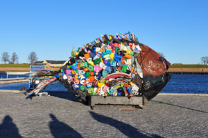 This fish sculpture created from trash is located on Wiibroe Plads street