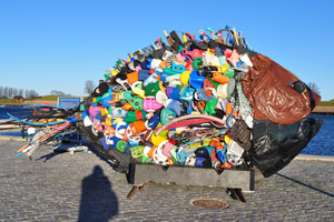 The fish sculpture is created from trash