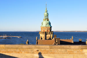 One of the towers of Kronborg castle is photographed on the background of Øresund