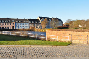 A series of apartment buildings on Frederiksværksgade street as seen from the south-western bridge of Frederiksborg Castle