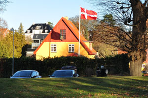 A Danish flag is waving over the house on Batzkes Bakke street