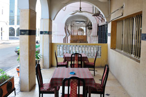 Cafe tables in front of the Ali Sabieh hotel