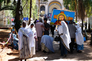 Believers and the icon of Jesus Christ near Holy Trinity Cathedral