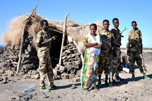Afar soldiers in the camp located close to the base of volcano