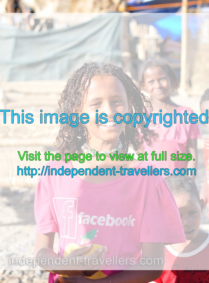 Afar girl is dressed in the pink T-shirt with facebook logo