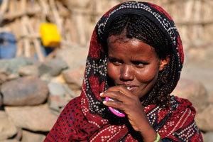 Afar woman tries to hide her smile