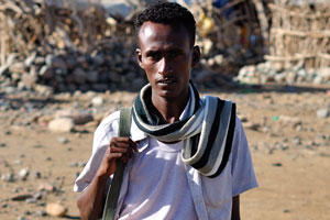 Young Afar man with an assault rifle