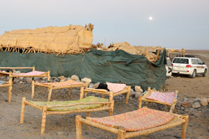 So, we have reached the camp and we see empty beds placed on the open air