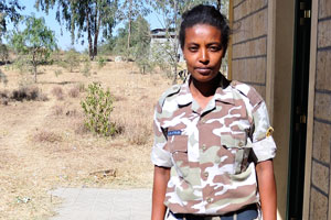 Beautiful Ethiopian police woman at the entrance to Martyrs' Memorial Monument