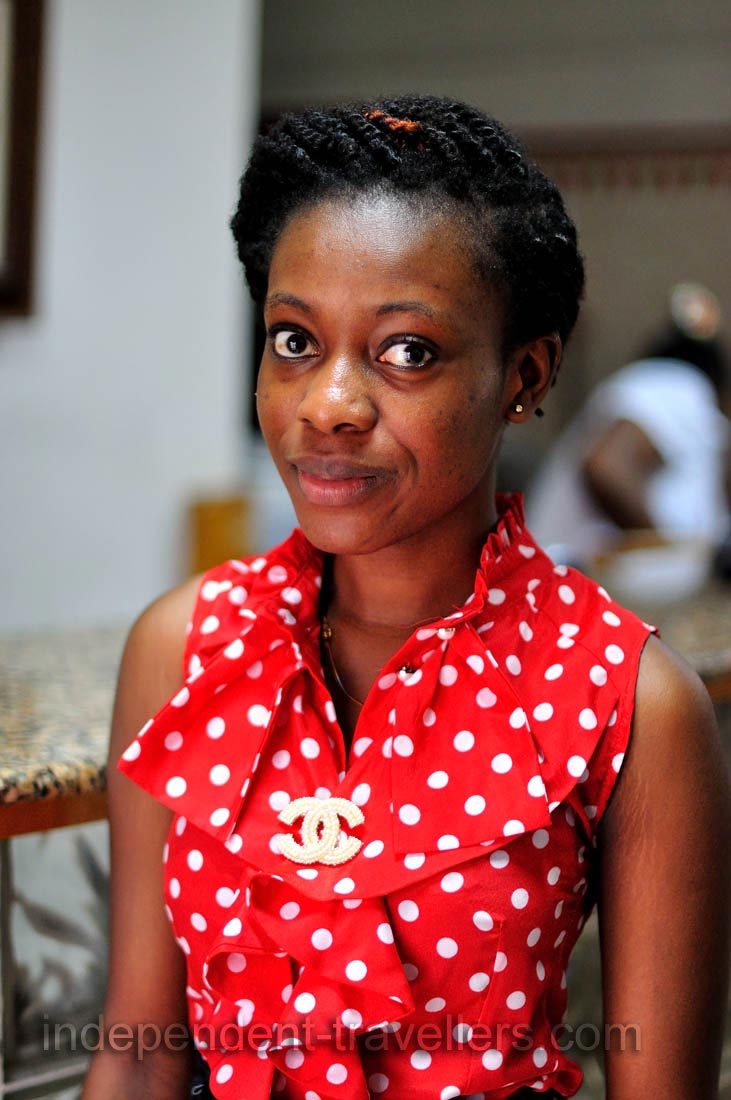 A pretty Ghanaian girl works at the reception of Pink Hostel