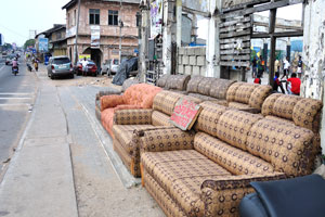 Various furniture from a furniture store are on the open air