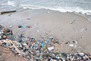 The shore of the Gulf of Guinea is full of the garbage near Jamestown