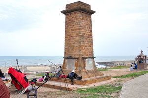 The brick tower is located close to the lighthouse