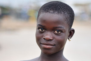 Young African girl from Ghana is smiling friendly