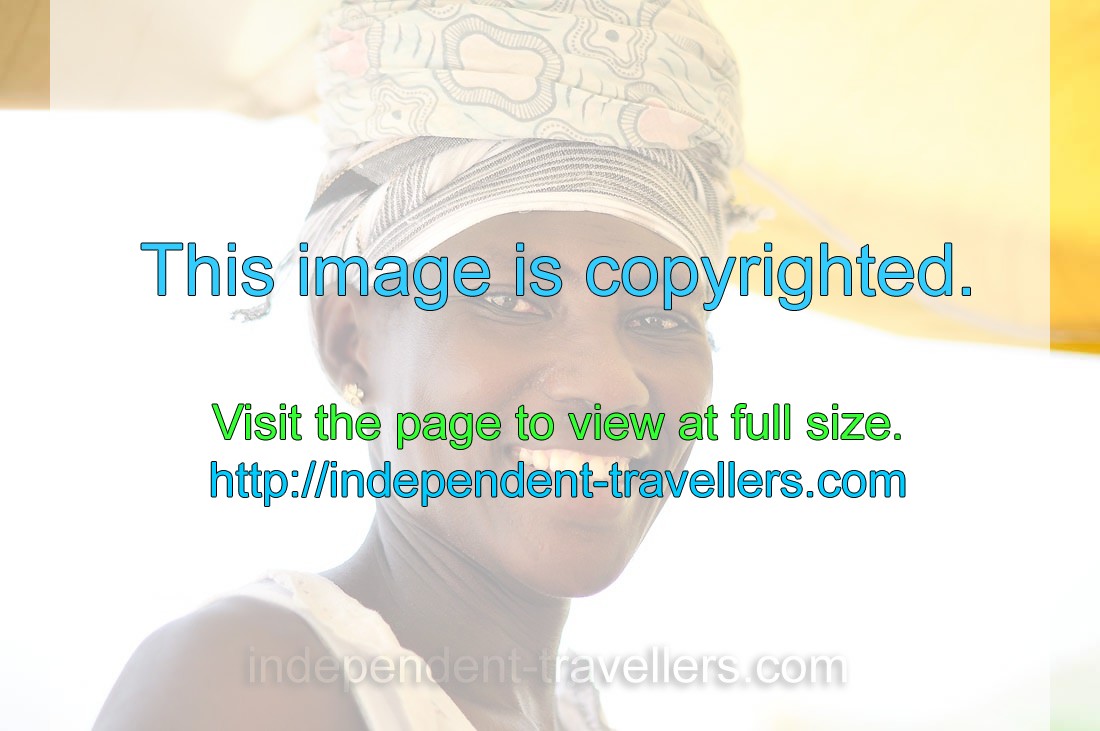 A Ghanaian female vendor nicely smiles