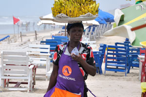 A female vendor of bananas keeps the water in her hand