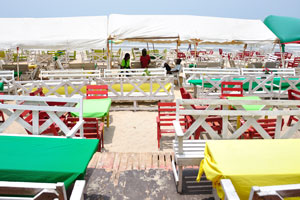 There are plenty of open air tables here on the beach