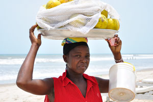 A female fruit vendor looks tired