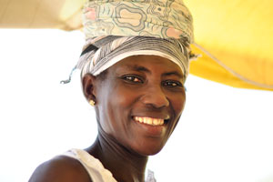 A Ghanaian female vendor nicely smiles