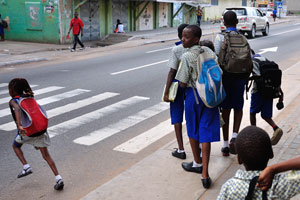 The children are crossing the John Evans Atta Mills High Street