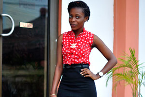 A stunning Ghanaian lady works at the reception of Pink Hostel
