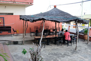 There is an outdoor cafe in the Pink Hostel