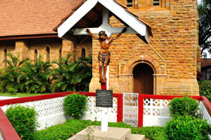 The statue of Jesus is located beside the church of Holy Trinity Cathedral